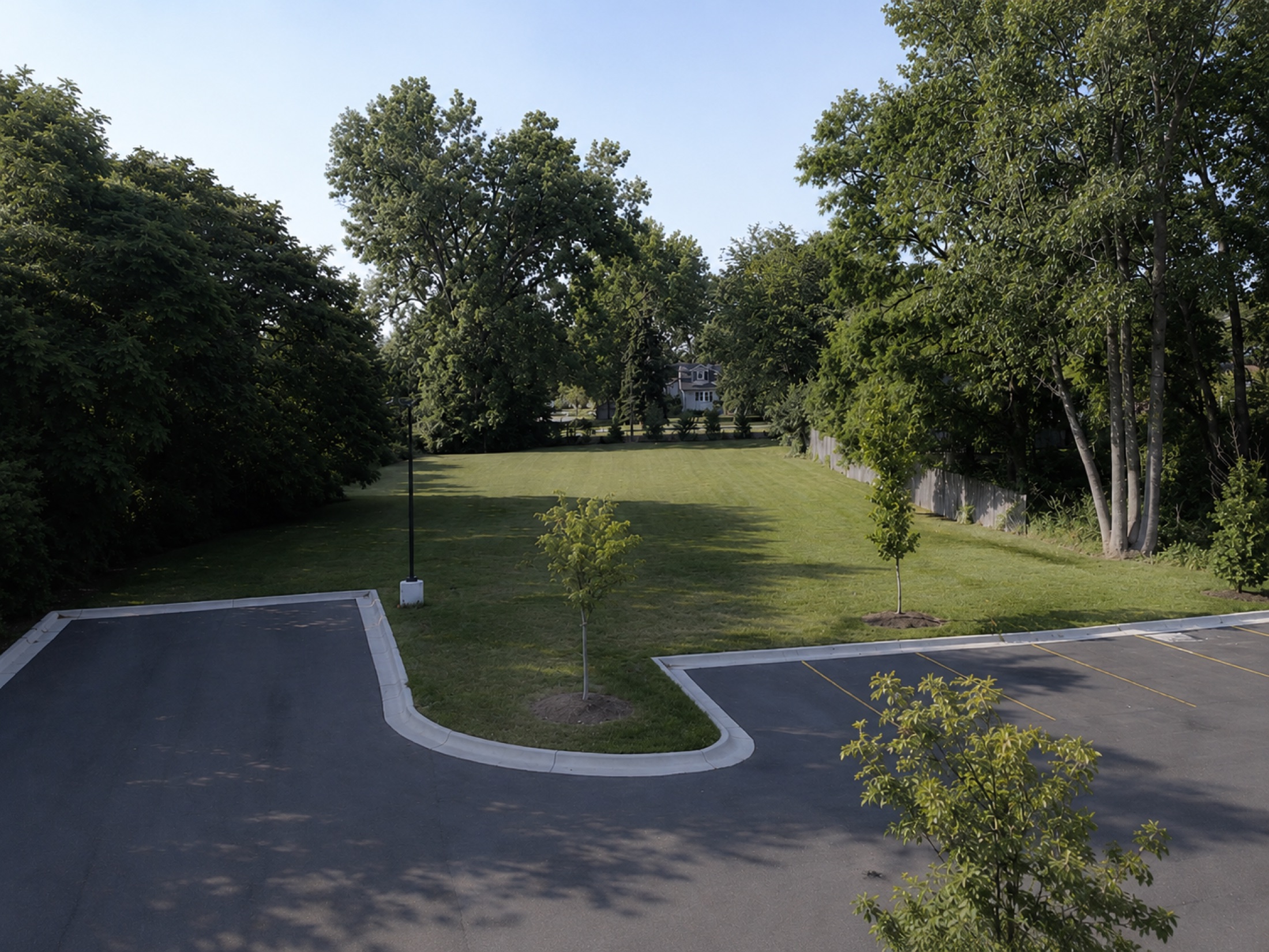 Visible Learning Center’s open green grounds surrounded by trees